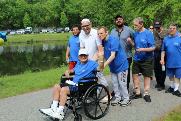 Staff and residents of New Concepts for Living walking in the Walk-A-Thon around the lake at Wood Dale County Park, Woodcliff Lake, NJ.